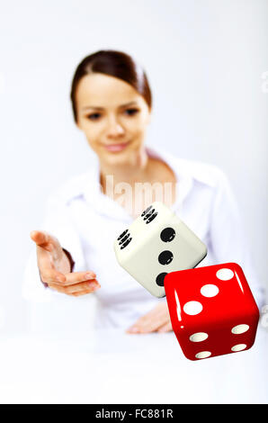 Image of a flying dice as symbol of risk and luck Stock Photo