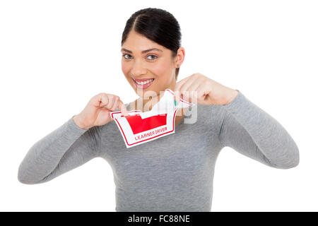 beautiful young woman tearing up learner driver sign on white background Stock Photo