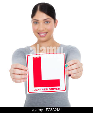 happy young woman presenting learner driver sign Stock Photo