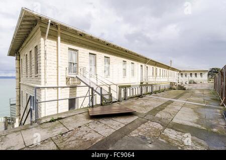 Building 64 on Alcatraz Penitentiary in San Francisco, California. An old, moldy, haunting residential building, which was used Stock Photo