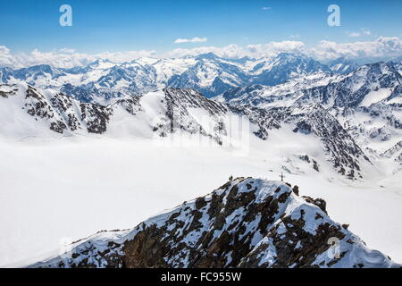 Aerial view of alpine skiers on Mount Dosegu, Stelvio National Park, Valtellina, Valfurva, Lombardy, Italy, Europe Stock Photo