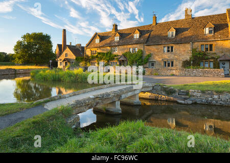 Stone bridge and cotswold cottages on River Eye, Lower Slaughter, Cotswolds, Gloucestershire, England, United Kingdom, Europe Stock Photo