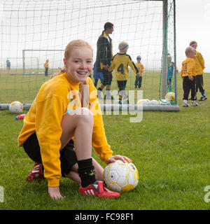 Young teenager playing football, Akranes, Iceland Stock Photo