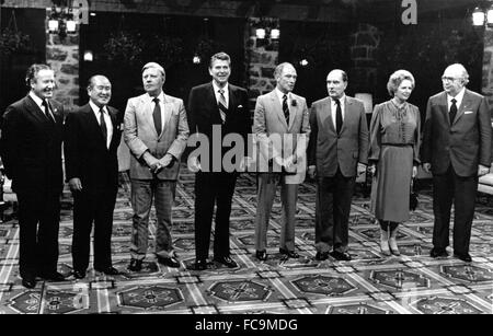 G-7 leaders pose for a group photo at the Chateau Montebello in Montebello, Quebec, Canada on July 20, 1981. From left to right: President Gaston Thorn of the European Commission, Prime Minister Zenko Suzuki of Japan, Chancellor Helmut Schmidt of West Germany, United States President Ronald Reagan, Prime Minister Pierre Elliott Trudeau of Canada, President François Mitterrand of France, Prime Minister Margaret Thatcher of the United Kingdom, and Prime Minister Giovanni Spadolini of Italy. Inclement weather forced the photo session to be moved indoors. Credit: Pool via CNP   - NO WIRE SERVICE - Stock Photo