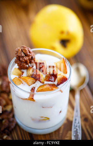 sweet yogurt with baked quince Stock Photo