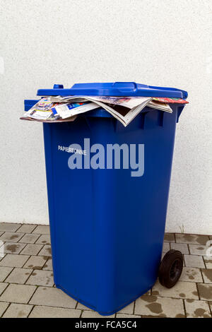 Blue bin, recycling bin for paper waste and yellow bags and bin for ...