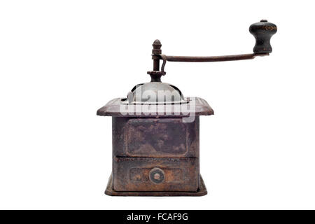 an old and rusty manual burr-mill coffee grinder on a white background Stock Photo