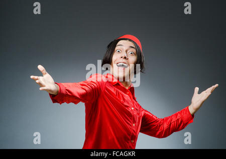 Man wearing red fez hat Stock Photo