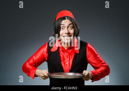 Man wearing red fez hat Stock Photo