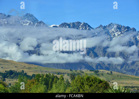 Clouds partly covering  The Remarkables   the famous iconic range of mountains and featured  in the film Lord of the Rings Stock Photo