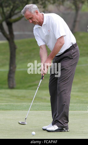 Former soccer player and coach Johan Cruyff hits the ball during a local golf tournament in Mallorca Stock Photo