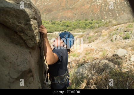 A girl trains rock climbing in Mission Gorge, San Diego, California. Stock Photo