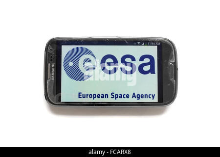 The European Space Agency logo on the screen of smartphone photographed against a white background. Stock Photo