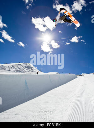 Snowboarder Riding Halfpipe Stock Photo