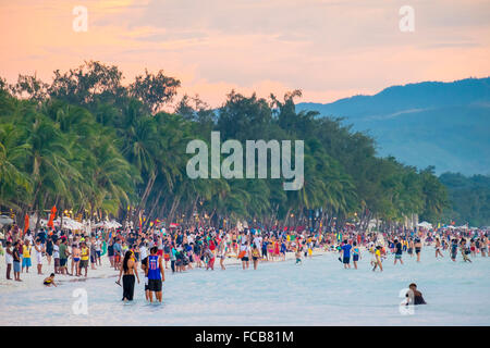 Crowds of people on White Beach at sunset, Boracay, Philippines Stock Photo