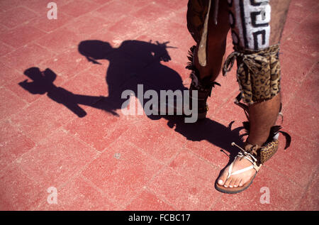 A Mayan Ball Player holds a torch during the first ®Pok Ta Pok® World Cup in Piste, Tinum, Yucatan, Mexico Stock Photo