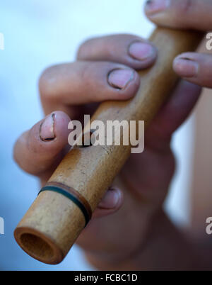 A Mayan ball player from Chimaltenango, Guatemala, plays the flute during the first ®Pok Ta Pok® World Cup in Piste, Tinum, Stock Photo