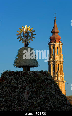 Zaragoza, Aragón, Spain: Virgin of the Pilar in Pilar square during the celebration of El Pilar, and Bell Tower of 'la Seo' Stock Photo