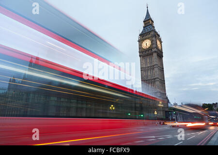 Big Ben in the early morning and red bus passing in London, natural colors Stock Photo