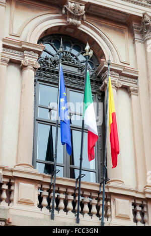 Colourful flags on a building in Bergamo Stock Photo