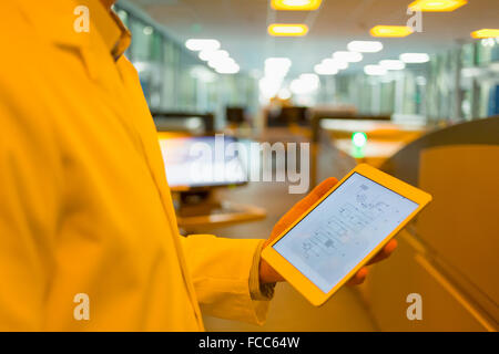 Engineer with digital tablet in factory Stock Photo