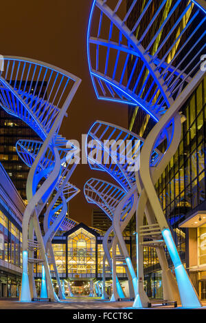 'Trees' sculpture designed to reduce wind gusts between the buildings on Stephen Avenue, night, downtown Calgary, Alberta Stock Photo