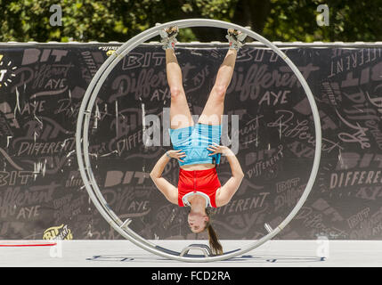 Christchurch, New Zealand. 22nd Jan, 2016. HANNAH CRYLE of Australia rolls across an outdoor stage in 'Boris, ' her large German wheel circus prop, at the 2016 World Buskers Festival. The 11-day event attracts some of the world's best street performers. © PJ Heller/ZUMA Wire/Alamy Live News Stock Photo