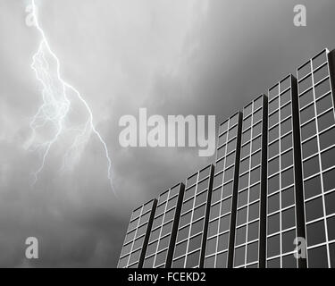 Bottom image of skyscraper with thunder lightning in sky Stock Photo