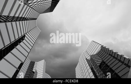 Bottom image of skyscraper with thunder lightning in sky Stock Photo