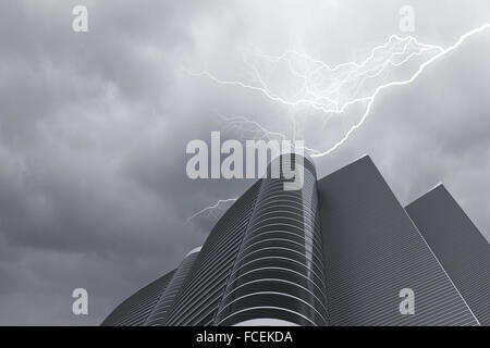 Bottom image of skyscraper with thunder lightning in sky Stock Photo