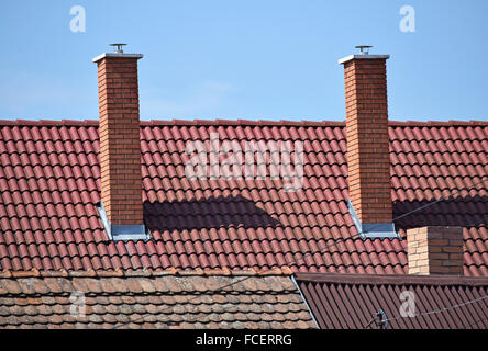 Smoke stacks on the roof Stock Photo