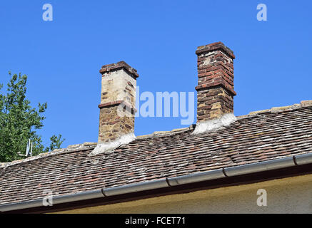 Smoke stacks on the roof Stock Photo