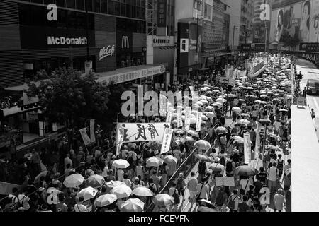 HONG KONG - JULY 1: Hong Kong people show their dissatisfaction to the Hong Kong by march on July 1, 2015 in Hong Kong. Stock Photo