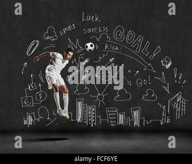 Football player in jump with sketches at background Stock Photo