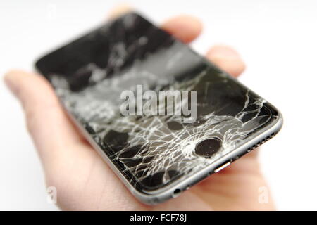 iPhone6 with broken glass hold in hand Stock Photo