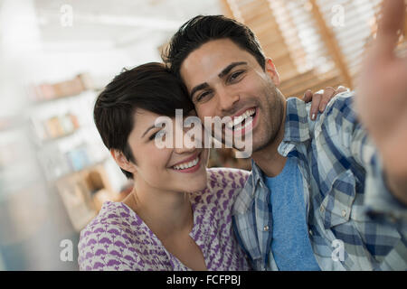 A couple, man and woman posing for a selfy. Stock Photo