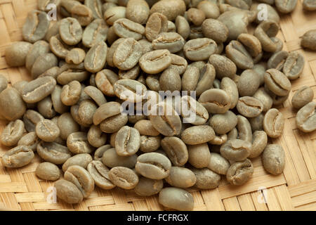 Heap of Bolivian Yanaloma green unroasted coffee beans close up Stock Photo