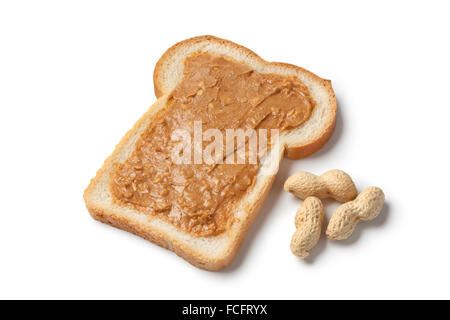 Slice of bread with peanut butter on white background Stock Photo