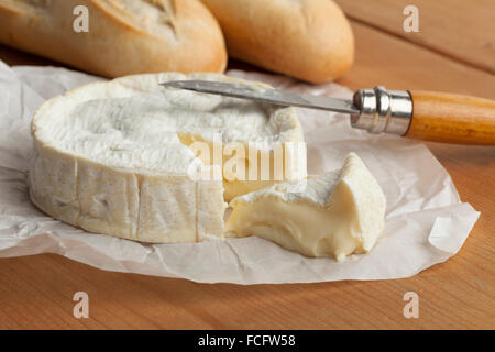 Ripe French camembert cheese and a slice Stock Photo