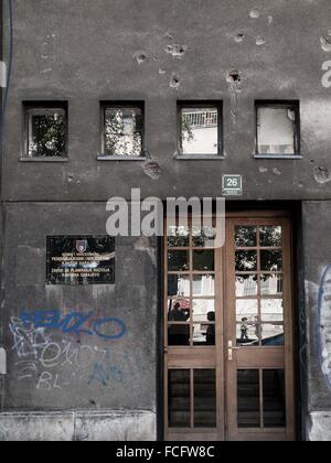 Gun shot holes on a gray concrete building in Sarajevo, Bosnia and Herzegovina, Europe. Stock Photo