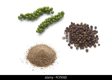 Fresh green pepper drupes, black pepper and powder on white background Stock Photo