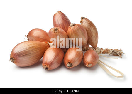 Bunch of fresh brown french shallots on white background Stock Photo
