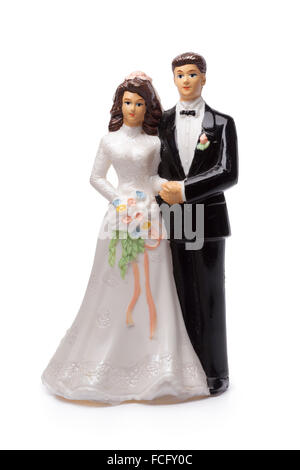 Bride and groom, old cake topper on white background Stock Photo