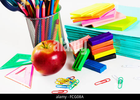 Colored pencils plasticine papers and other school items Stock Photo