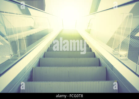 Escalator. Retro style filtred image Stock Photo