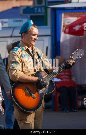 Russian war veteran busking on street in the Zamoskvoreche district of Moscow, Russia Stock Photo