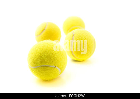 Four tennis balls isolated on white background Stock Photo