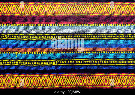 Cross stitch embroidery on canvas.Tribal handmade woven cotton fabrics form Chiengmai, Thailand. Pattern for design element. Stock Photo
