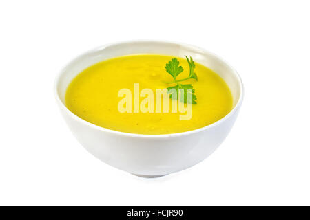 Soup-puree pumpkin with parsley in a white bowl isolated on white background Stock Photo