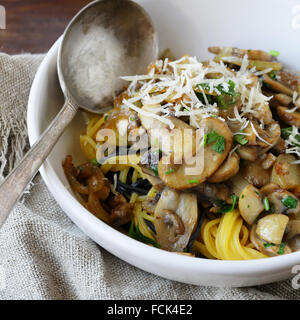 spaghetti with mushrooms and cheese in bowl Stock Photo